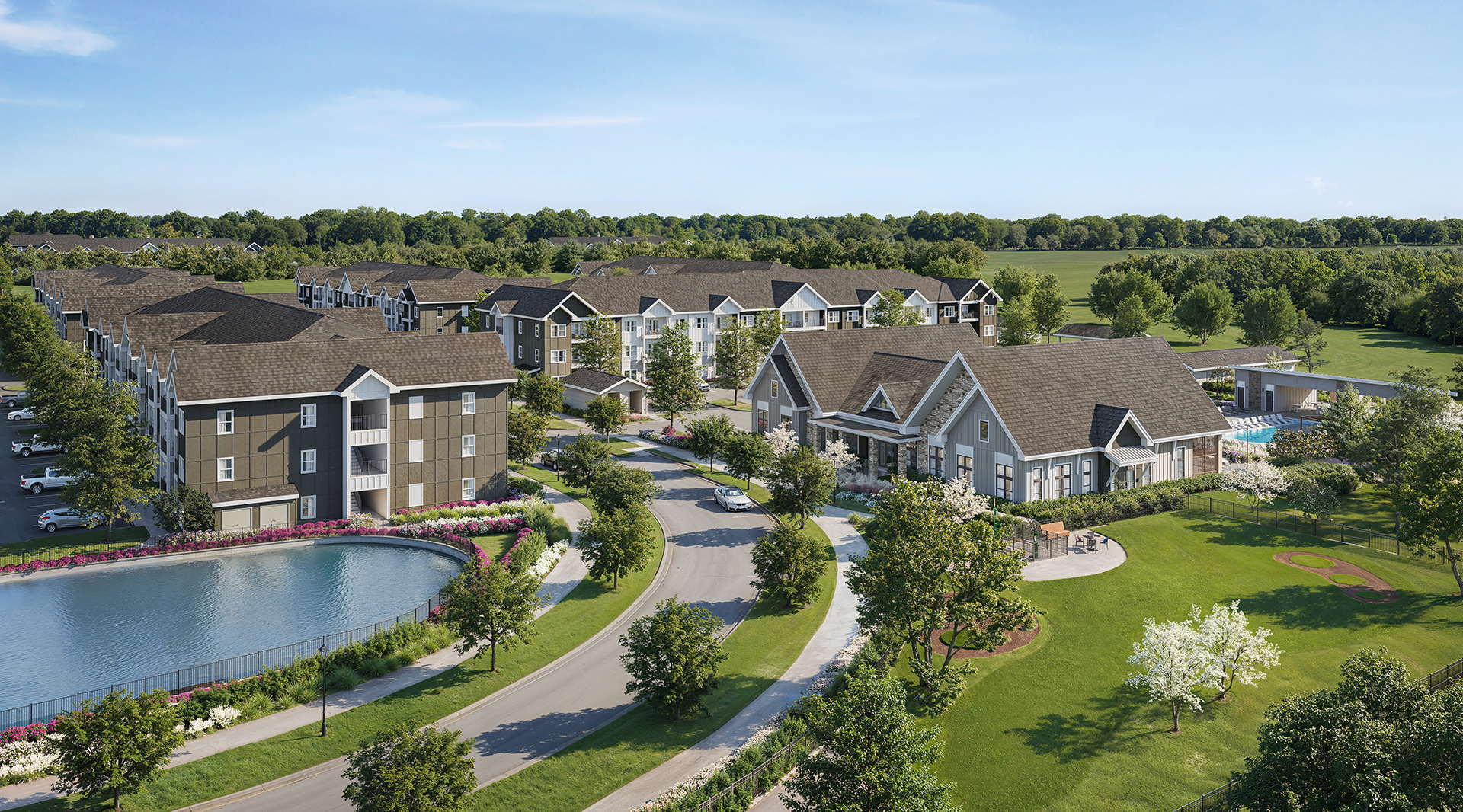 Apartment community with clubhouse, lake, walking paths, and green spaces