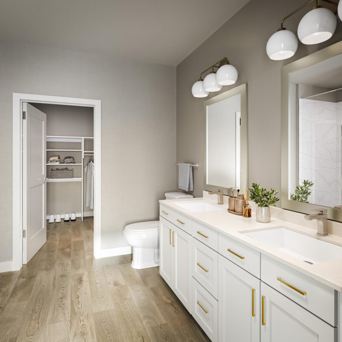 Modern apartment bathroom with double vanity and walk-in closet