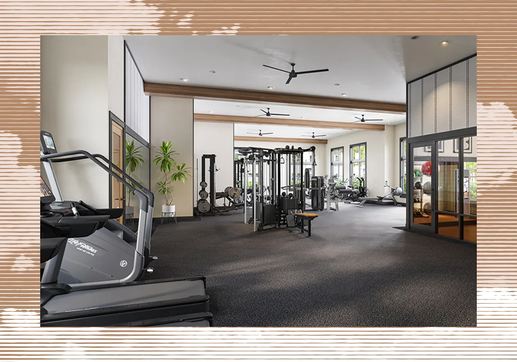 Modern fitness center with cardio machines and strength training equipment